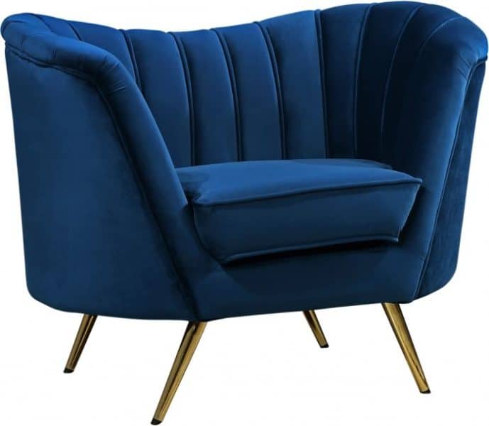 Royal blue velvet lounge chair featuring modern brass legs