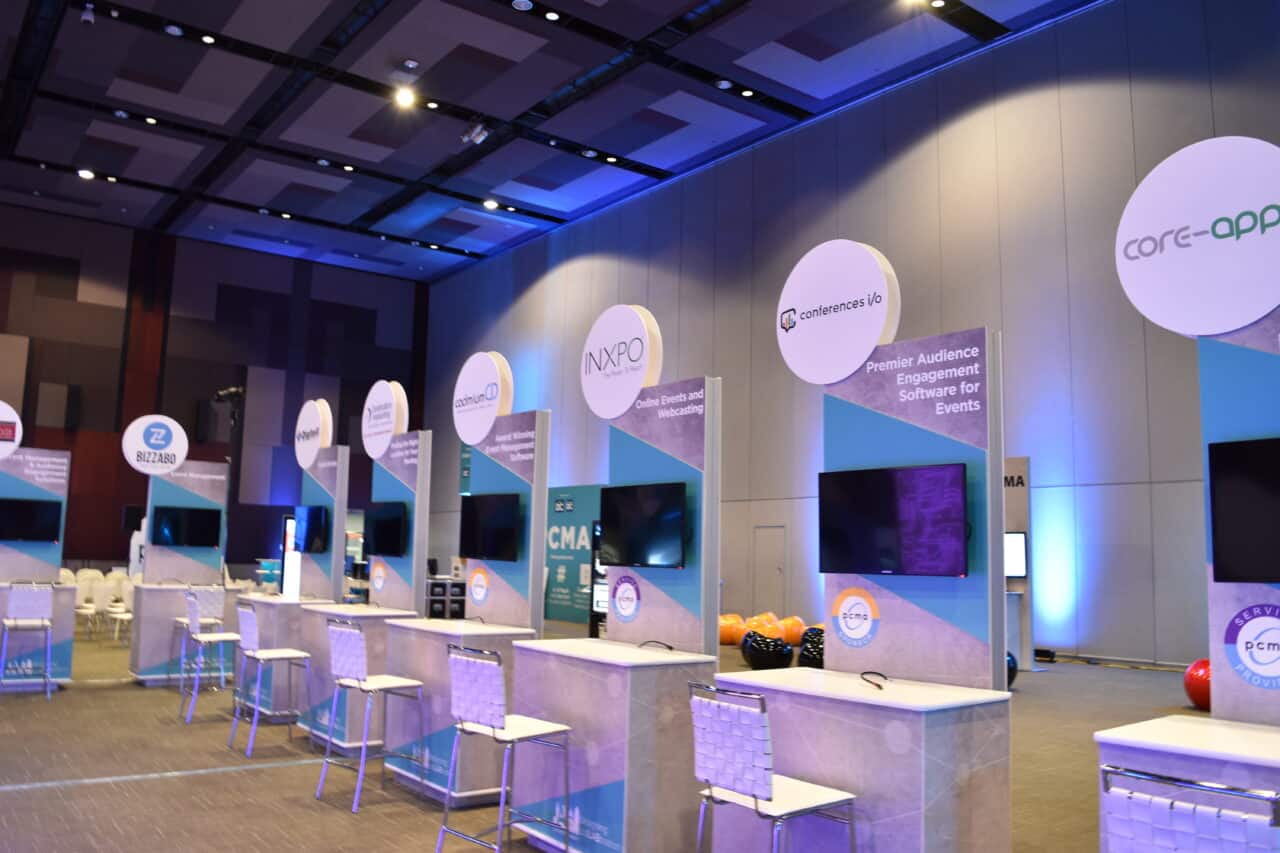 Branded trade show booth with custom event furniture rental in Columbus